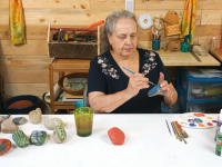 woman making garden marker stones
