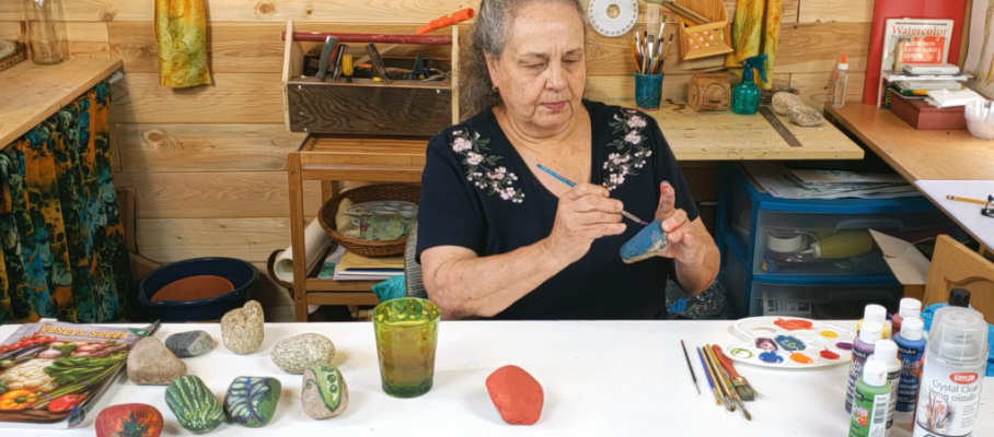 woman making garden marker stones